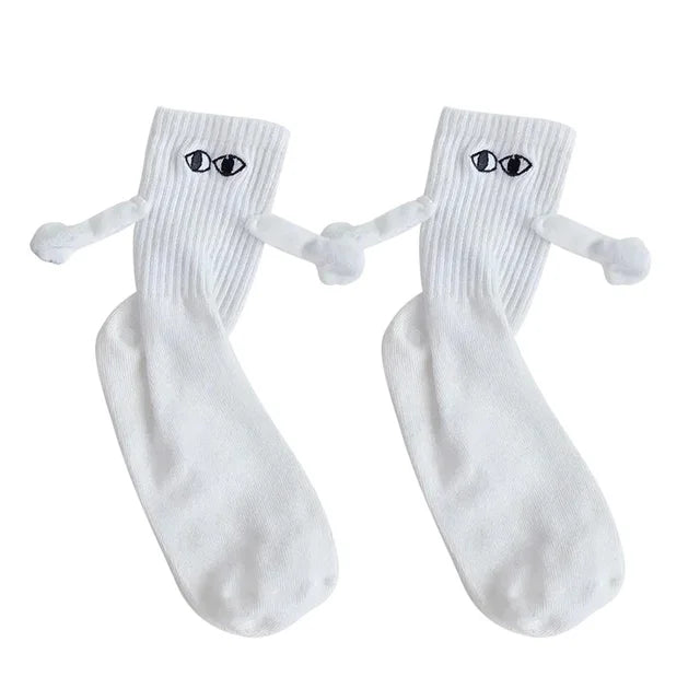 Chaussettes de couple magnétiques se tenant la main