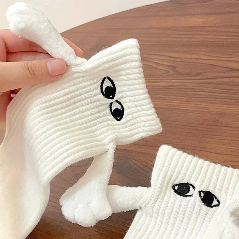 Chaussettes de couple magnétiques se tenant la main