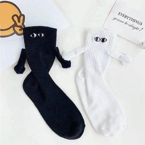 Chaussettes de couple magnétiques se tenant la main